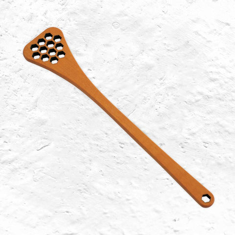 Honey spoon with hexagonal holes by Berstenhaus Redecker