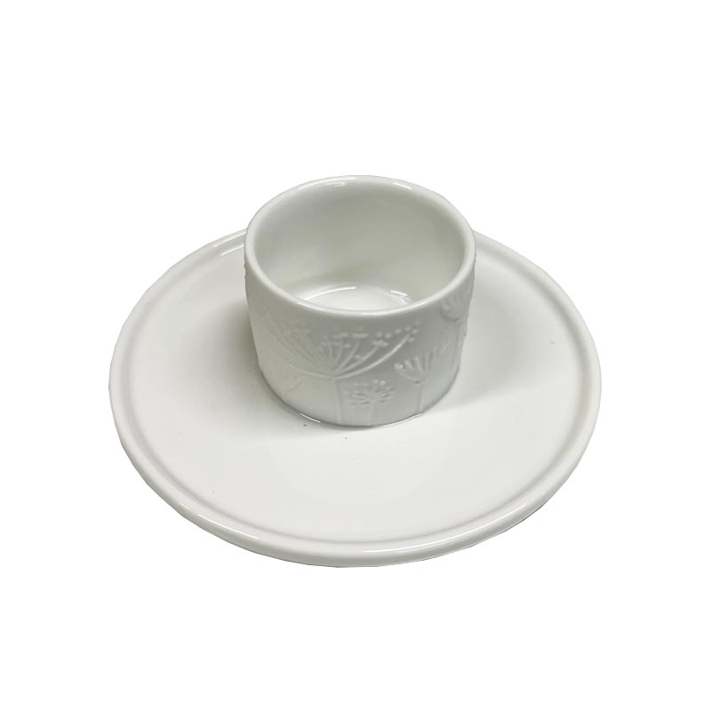 Porcelain floral egg cup and saucer by Rader