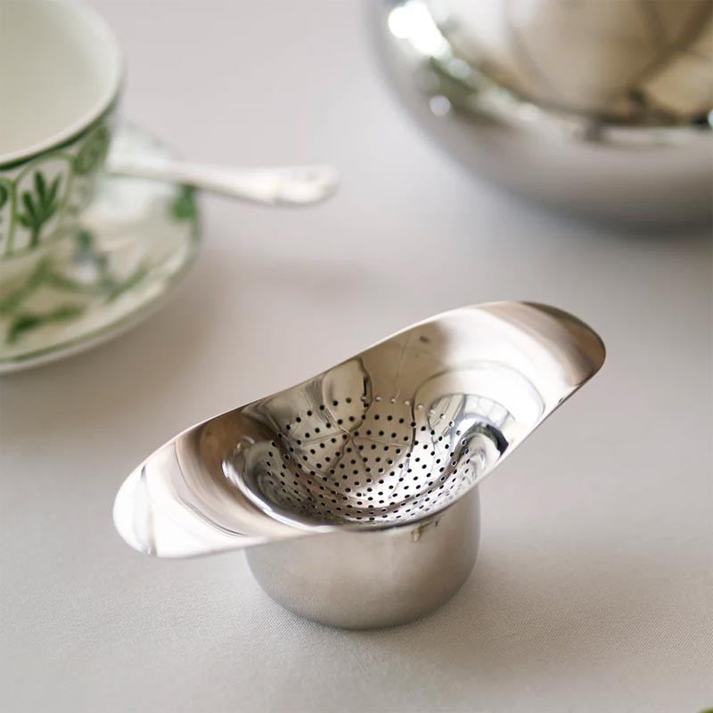 Drift tea strainer & bowl by Robert Welch