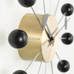 Ball wall clock (brass and black) des. George Nelson, 1948 - 1960 (made by Vitra)