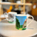 A Year in Normandie Mug by David Hockney (Two Houses and Hay Bales)