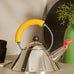 Kettle 9093/1 - yellow - des. Michael Graves, 1985 (made by Alessi)