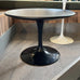 Saarinen round low side table - black top, black cast aluminium base - des. Eero Saarinen, 1957 (made by Knoll)