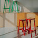 Taburete 8 Bar Stool - Low - Signal Red Powder Coated Base / H65 Water-Based-Lacquered Oak Veneer Seat, des. Marc Morro for HAY