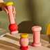 Twergi grinder - pink, red and yellow - des. Ettore Sottsass for Alessi, 1989 (2021 reissue)