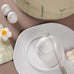 Porcelain floral egg cup and saucer by Rader