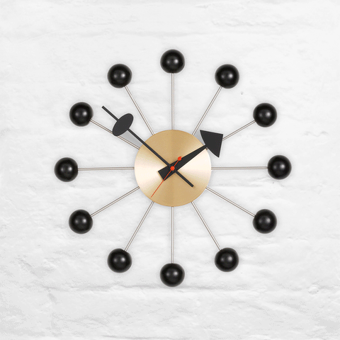 Ball wall clock (brass and black) des. George Nelson, 1948 - 1960 (made by Vitra)