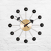 Ball wall clock (brass and black) des. George Nelson, 1948 - 1960 (made by Vitra)