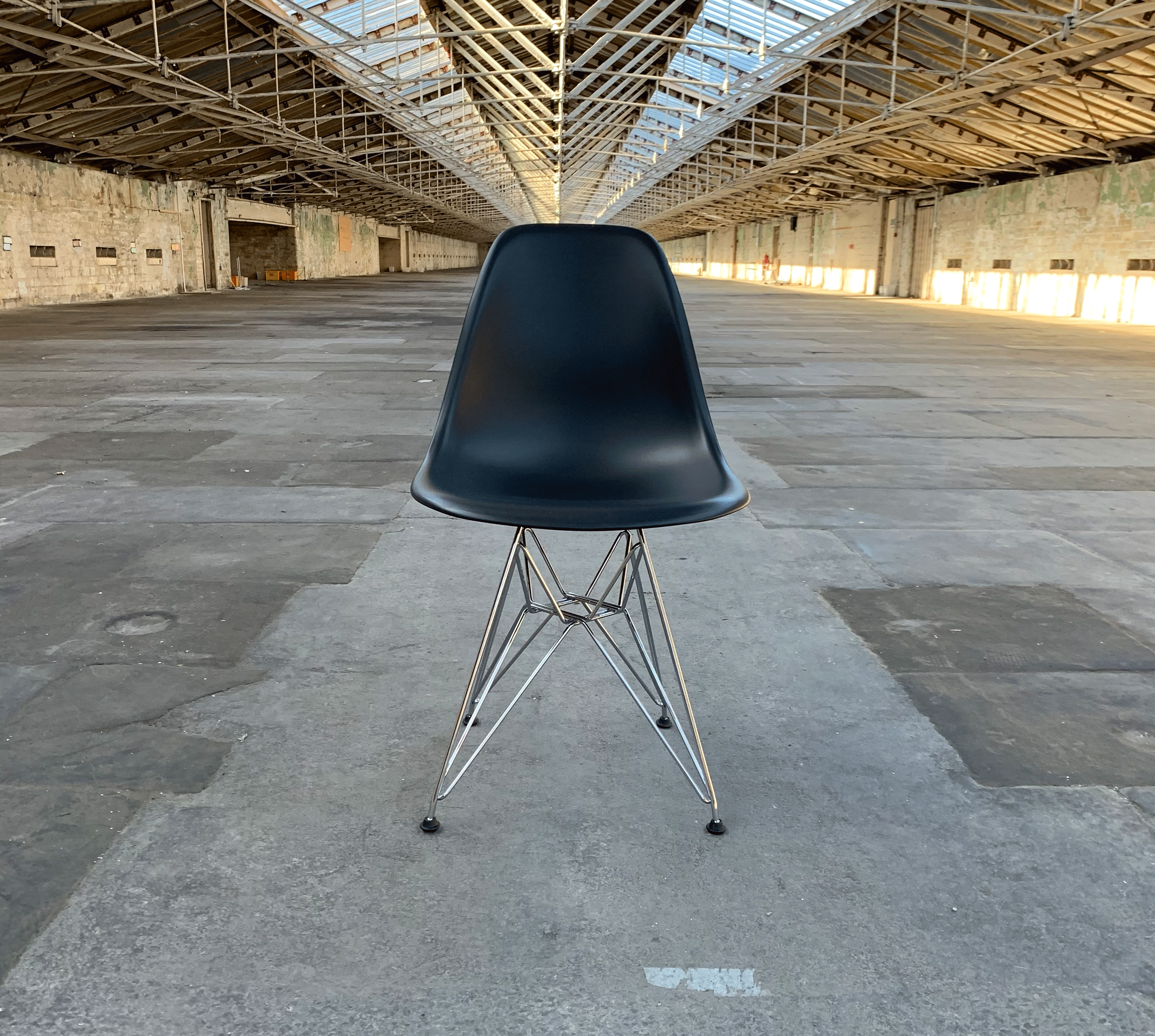DSR Plastic Side Chair des. C R Eames 1950 black shell chrome legs made by Vitra Salts Mill Shop